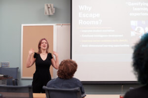Haley Gilley, a sophomore at Radford’s Davis College of Business and Economics, presents data from her research on the 'gamification' of the learning experience. The idea is that professors who create escape-room-type experiences based on their coursework will increase student motivation to learn the material. Photo by Suzanne Carr Rossi.