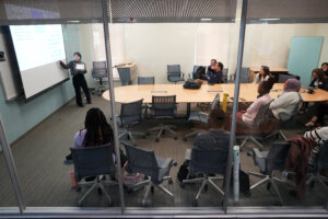 A student researcher presents her findings during the Network for Undergraduate Research in Virginia Conference, held in the University of Mary Washington's Hurley Convergence Center. Photo by Suzanne Carr Rossi.