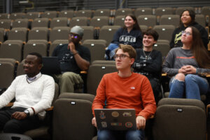 Students sit in seats in the Hurley Convergence Center's Digital Auditorium.