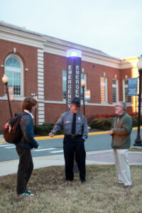 Photo of Rosenquist, Hall and Griffith, who created a blueprint for campus safety by mapping UMW's emergency blue light phone system.