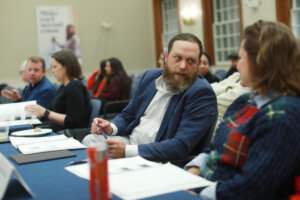 Two judges confer during the Case Competition