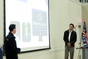 Photo of two UMW students making a presentation at the Fall 2025 College of Business Case Competition