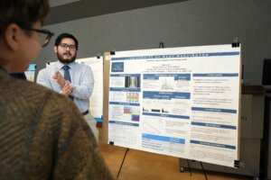 A UMW student presents a research poster