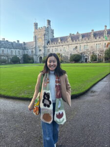 Smiling student on the quad at University College Cork in Ireland.