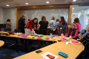 Participant at UMW's Maker Mindset Conference sort through colorful plastic objects.