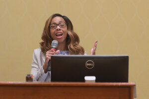 University of Mary Washington Associate Provost for Community Relations and Compliance Shavonne Shorter addresses the crowd before the recent Braver Angels debate at UMW. The unique debate format asks participants to arrive with open minds and hearts, listen as much as they speak, and challenge ideas without attacking. Photo by K Pearlman Photography.