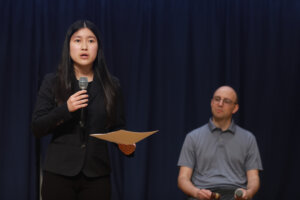 Alina Jiang, who's double enrolled in high school and at Germanna Community College, speaks to the crowd at a recent Braver Angels debate at the University of Mary Washington. The topic up for discussion was social media's potential to threaten democracy. Photo by K Pearlman Photography.