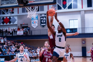 Photo of Freshman guard Josh Sewordor driving to the basket