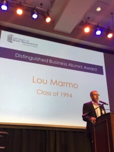 Photo of Lou Marmo on stage speaking after receiving an award