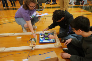 Virginia Science Olympiad competitors prepare their hovercraft for judging inside the Goolrick Fitness Center. Photo by Suzanne Carr Rossi.