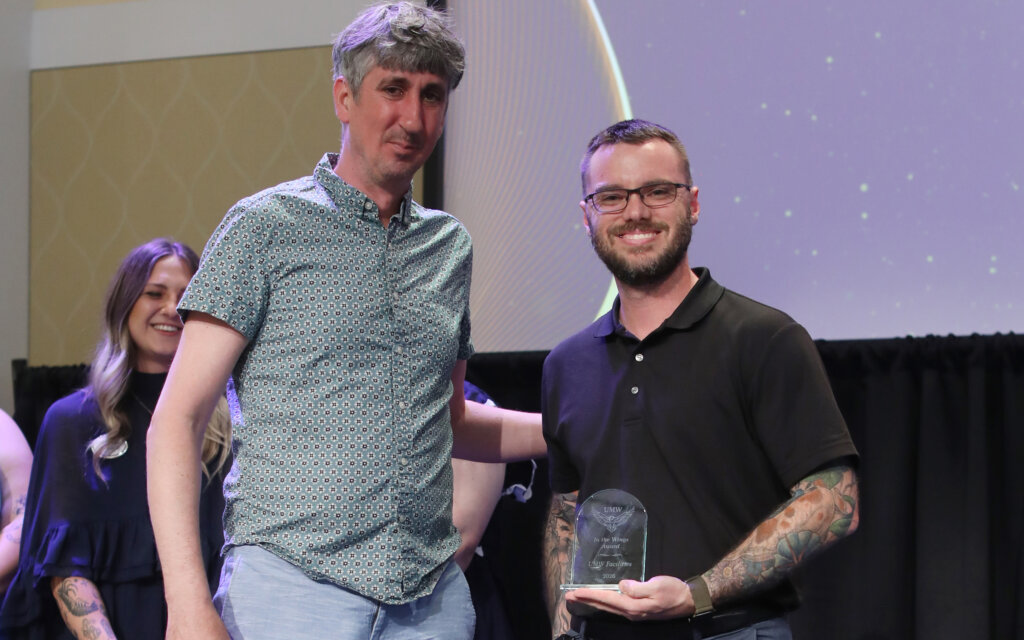 People accepting an award onstage