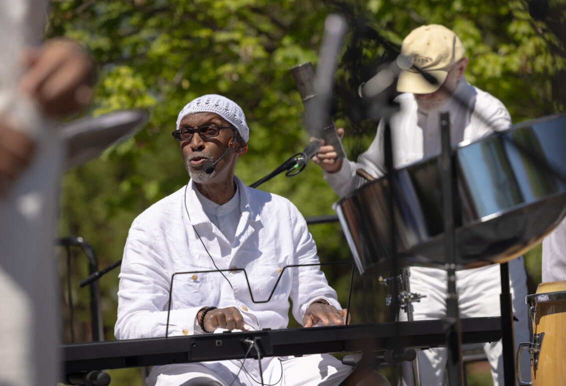 A musician sits at a keyboard