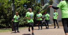 Jump ropers dressed in green perform
