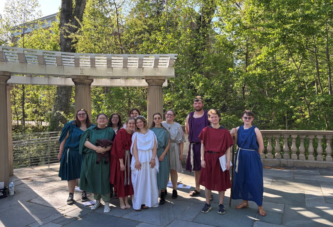 students pose on stage after a performance