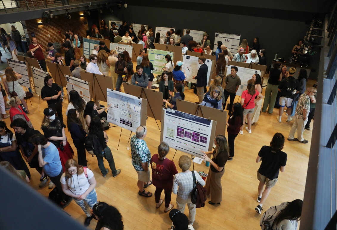 Many research posters on display in the Digital Auditorium at the Hurley Convergence Center