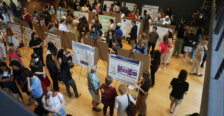 Many research posters on display in the Digital Auditorium at the Hurley Convergence Center