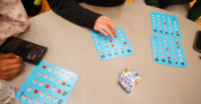 A table with blue Bingo cards on it