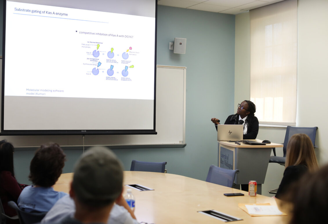 A student presenting at a podium