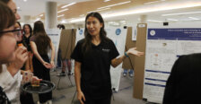 A student presents a poster