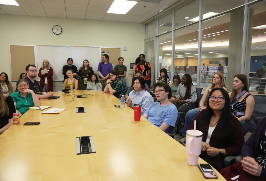 Large group of students, faculty and staff in a classroom