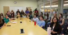Large group of students, faculty and staff in a classroom