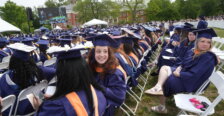 A lawn filled with soon-to-be graduates