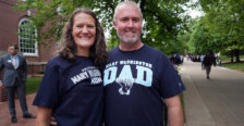 A mom and dad wearing Mary Washingon T-shirts