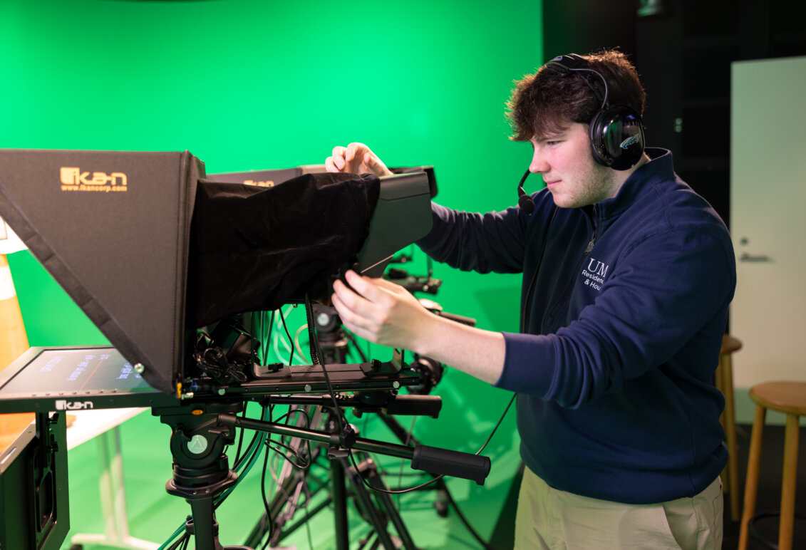 Clinton behind the camera in the digital production studio