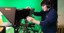 Clinton behind the camera in the digital production studio