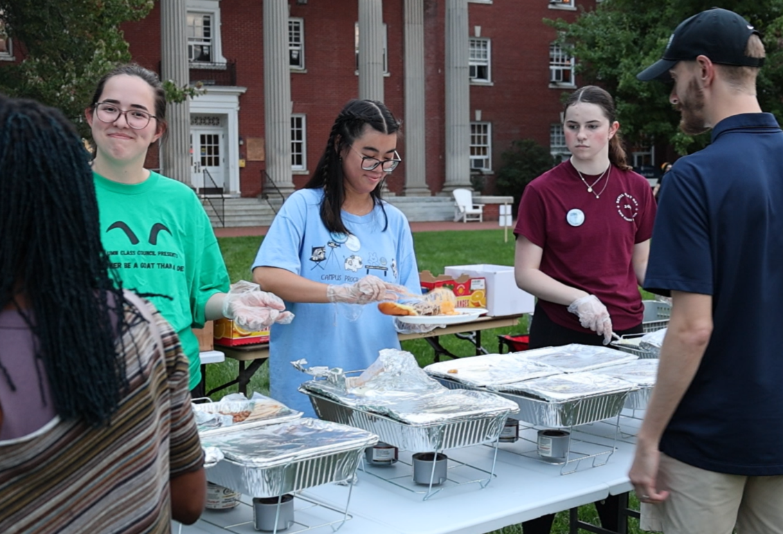 Ashley Lam gets food outdoors at a student event