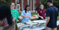 Ashley Lam gets food outdoors at a student event