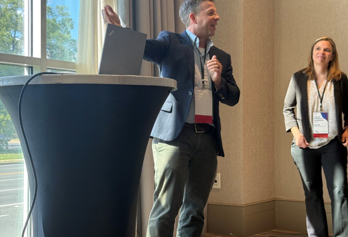 Marty Bywaters-Baldwin giving a presentation at a Symposium