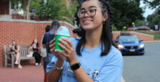 Ashley Lam holds a snow cone at a student event outdoors on campus