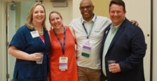 Katie Turcotte and Mark Thaden with an alumni couple.