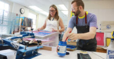 A 2000 alumna learns screenprinting from a UMW studio art professor.