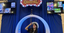 Ashley Lam sits in a swing at the National Association for Campus Activities conference