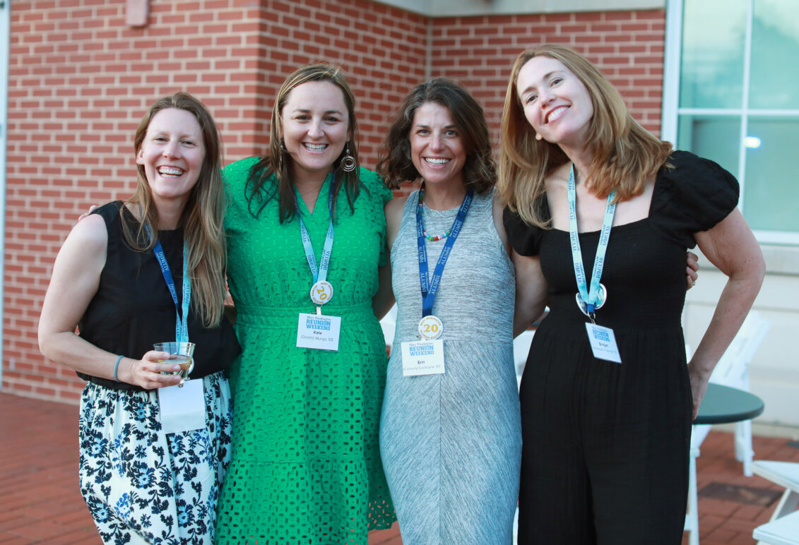 Four alumnae outside the Cedric Rucker University Center at the all-class party.