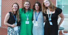 Four alumnae outside the Cedric Rucker University Center at the all-class party. 