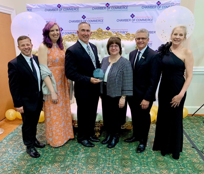 Marty Bywaters-Baldwin poses with coworkers from Rappahannock Goodwill