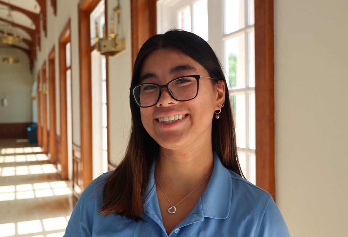 Photo of Ashley Lam in a blue polo inside Lee hall at UMW