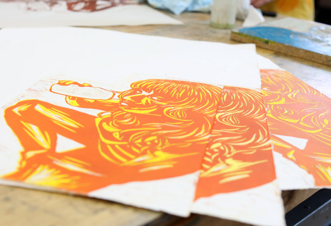 An orange and yellow piece of artwork.