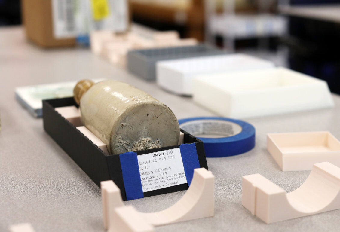 A bottle is shown in a artifact box.