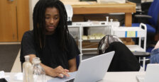 A student looks at a laptop in a historic preservation lab.
