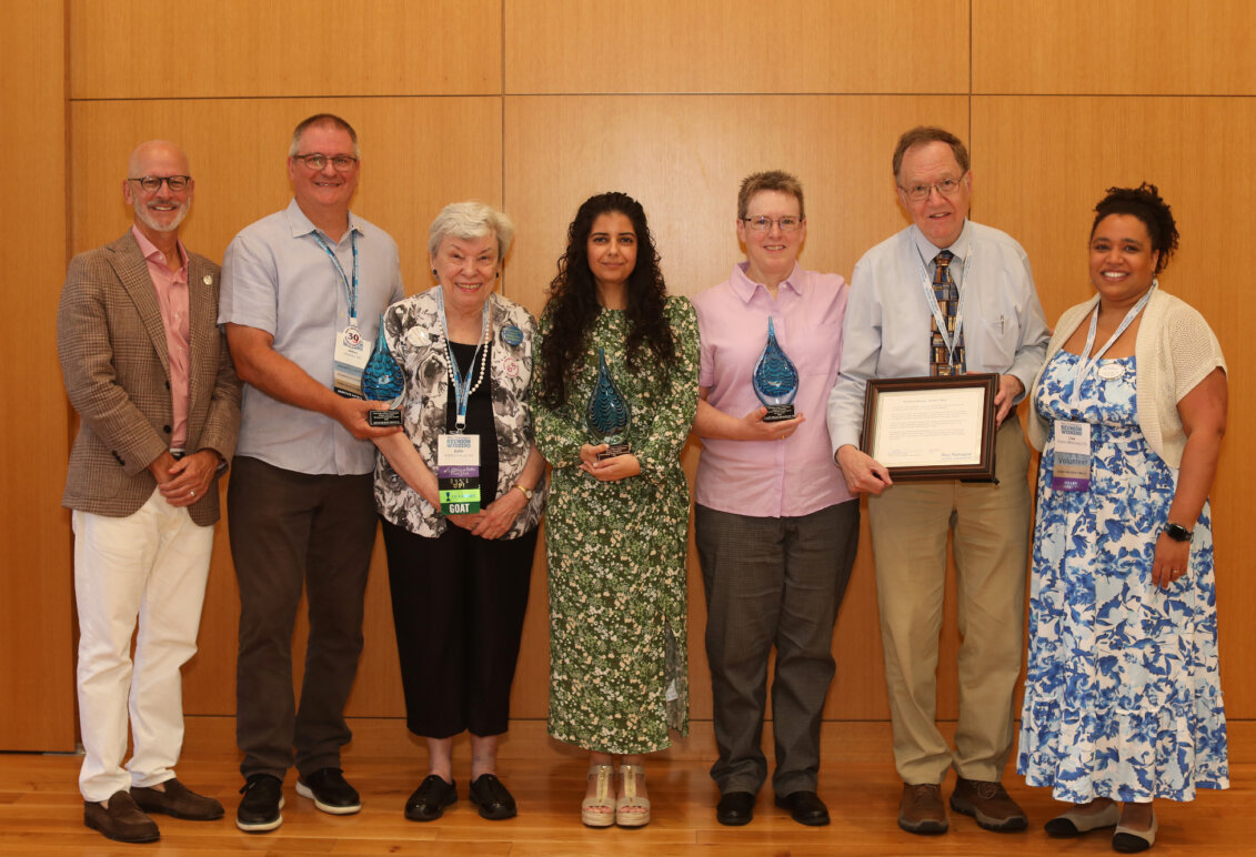 UMW President Troy Paino, Alumni Association leaders and four alumni holding awards.