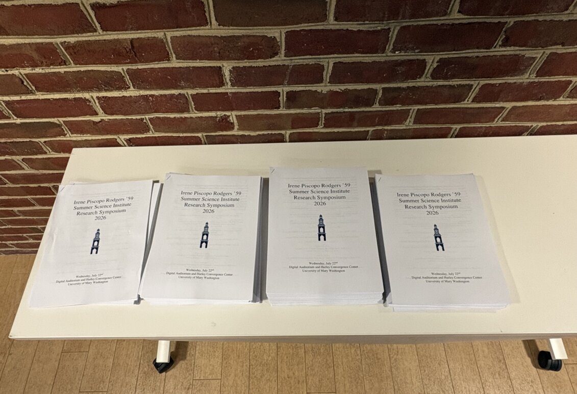 Booklets on a table at the symposium