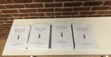 Booklets on a table at the symposium