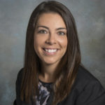 image of woman with dark hair and dark top
