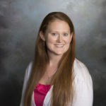 image of woman with light brown hair and white sweater