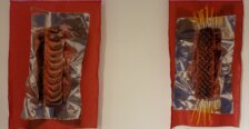 Two mixed-media artworks featuring sculpted, grilled food forms on reflective silver material and red fabric.