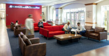 Students and faculty gather in the College of Business lobby.